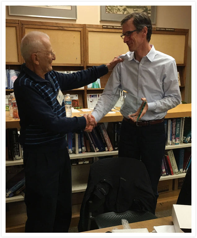 Dr. Bennett & Stan Rosenfeld shaking hands